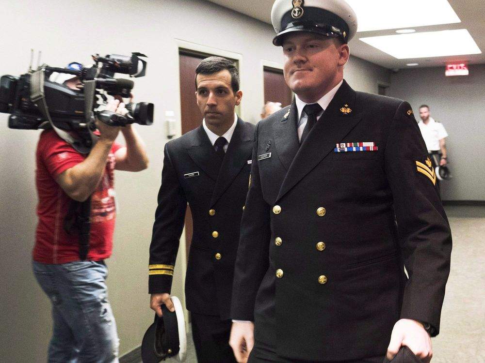 Accused Master Seaman Daniel Cooper, right, arrives for his standing court martial case in Halifax on Tuesday Sept. 26, 2017. A court martial for a member of the Royal Canadian Navy accused of sexual assault and ill treatment of a subordinate is expected to reconvene today in Halifax. THE CANADIAN PRESS/Ted Pritchard.