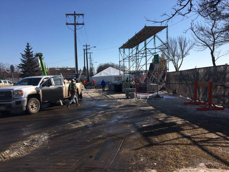 Workers dismantle the Red Bull Crashed Ice track Sunday morning following the championships.