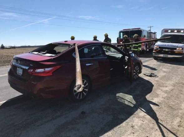 Elgin OPP say a driver is lucky to be alive after a pole dislodged from a transport struck the vehicle. 