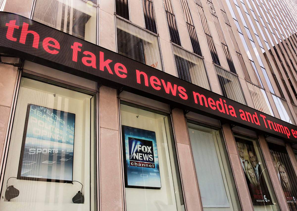 News headlines scroll above the Fox News studios in the News Corporation headquarters building in New York, Tuesday, Aug. 1, 2017. 