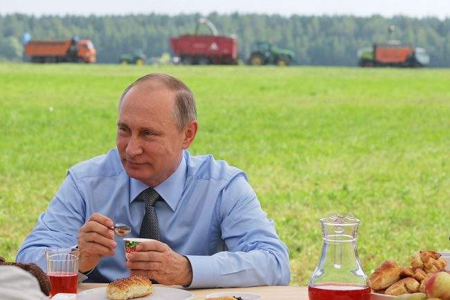 Russia's President Vladimir Putin meets with employees of a livestock facility in Russia's Tver region, July 28, 2016.