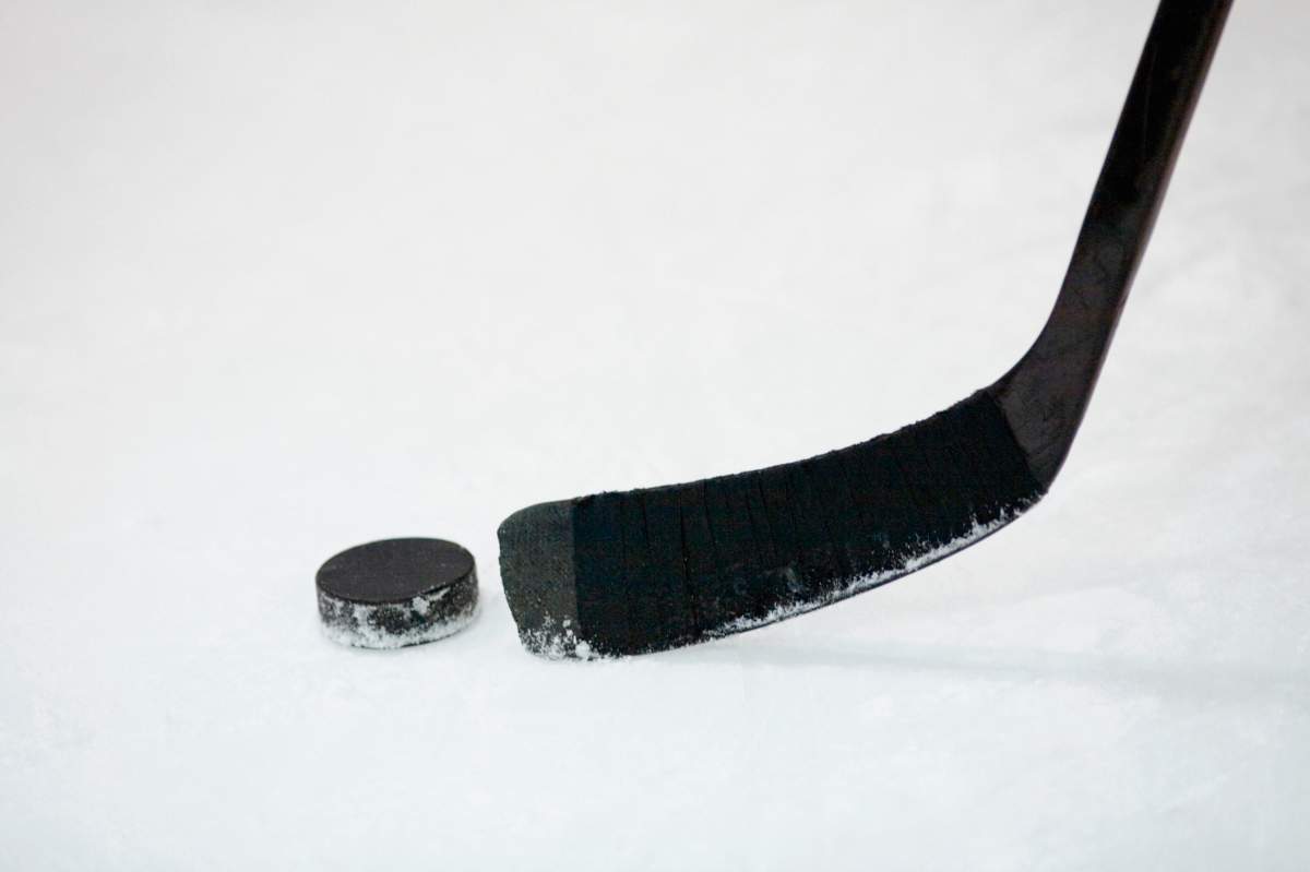 Lloydminster RCMP have charged two men with assault after a fight with referees after a hockey game last month.