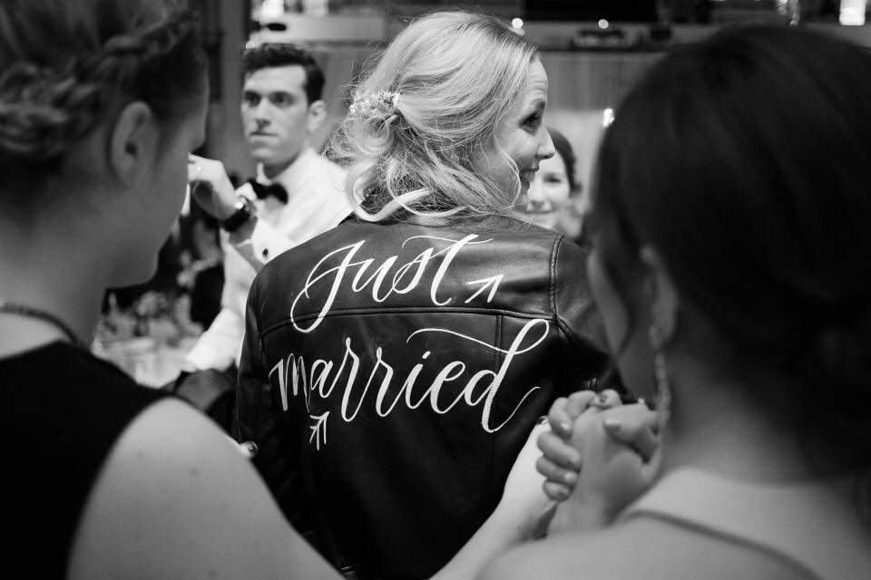 Amanda, Montreal’s first bride wearing the local “Just Married Jacket” .
