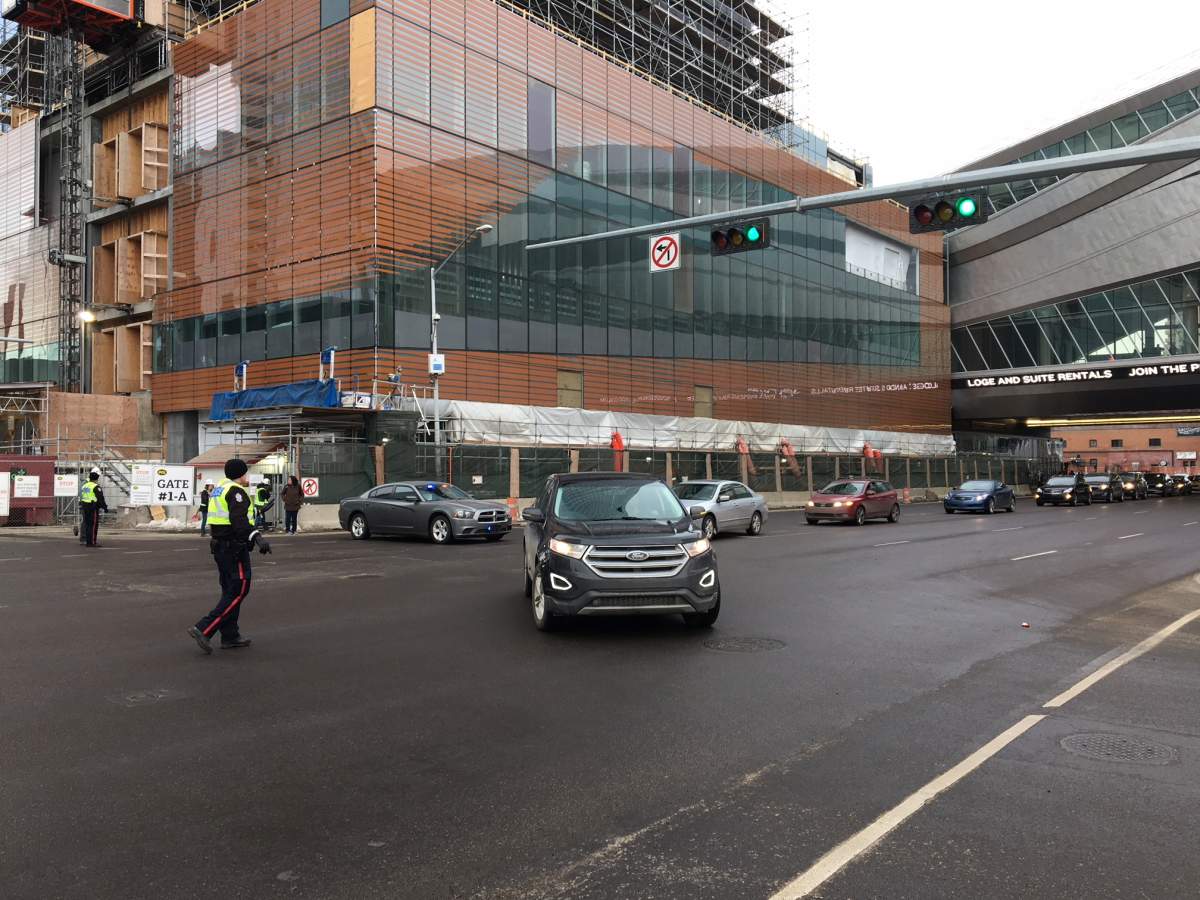 Police and emergency crews surrounding the Edmonton Tower on 104 Avenue and 101 Street. Thursday, March 1, 2018.