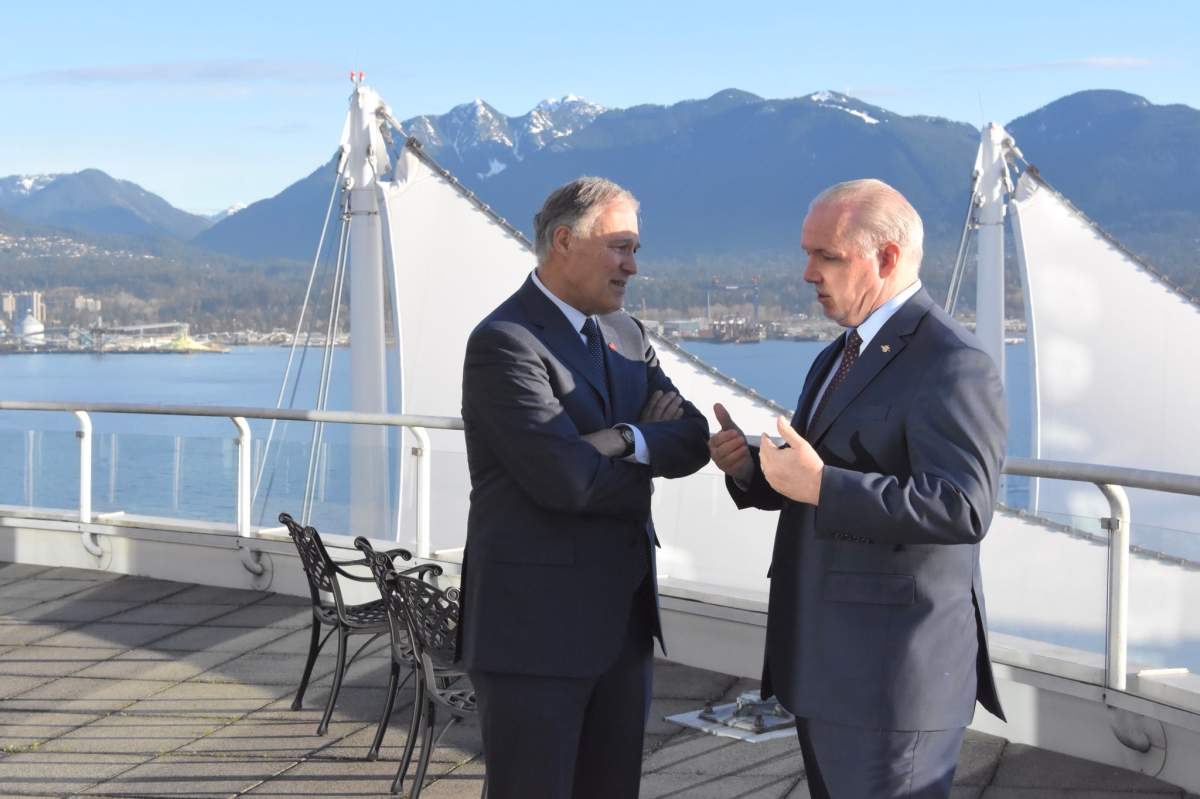 Washington State Governor Jay Inslee with B.C. Premier John Horgan in Vancouver on March 16.