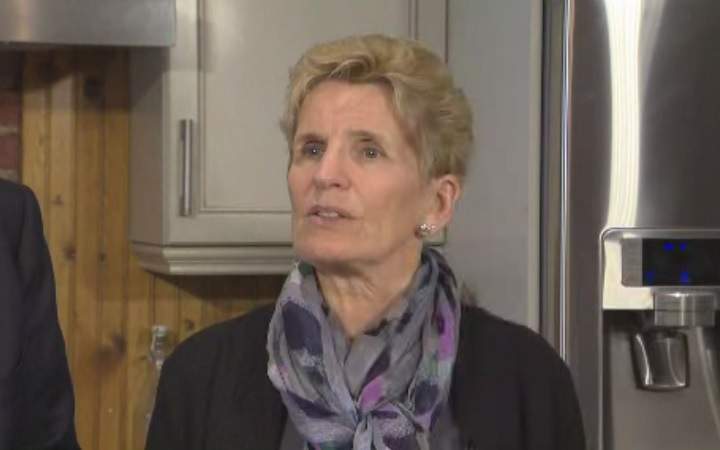Premier Kathleen Wynne speaks to reporters in Toronto on March 14, 2018.