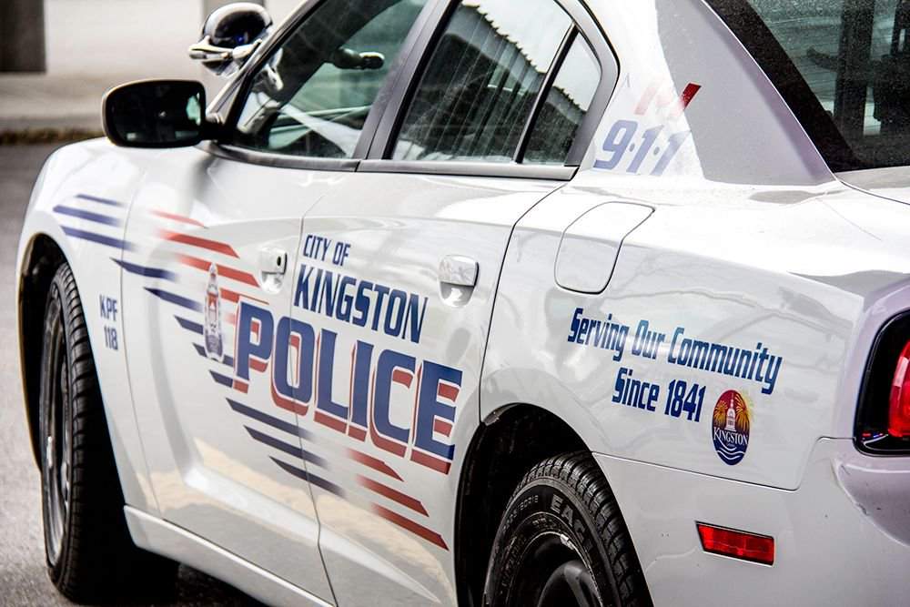 A Waterloo, Ont., man allegedly violently attacked his girlfriend and then sent naked photos of her to one of her family members, says Kingston police.