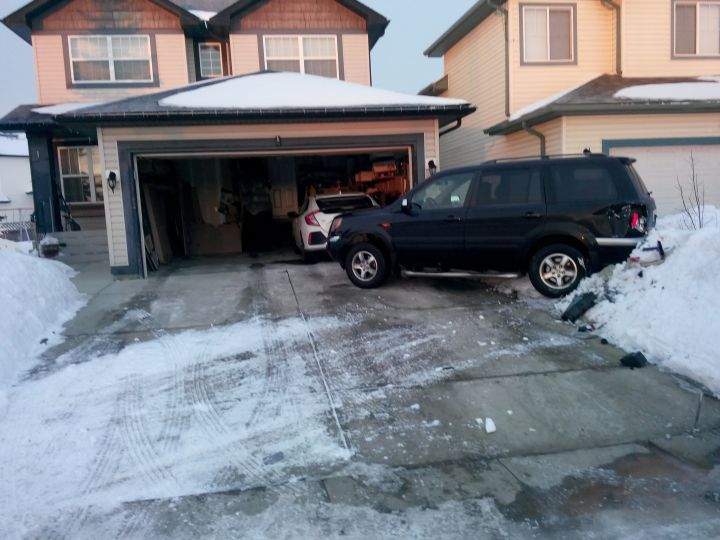 Picture of Long Huynh’s SUV that was hit while parked in his driveway.