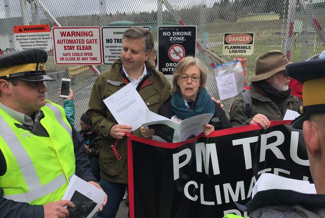 MPs Elizabeth May and Kennedy Stewart join protesters at Kinder Morgan facility.