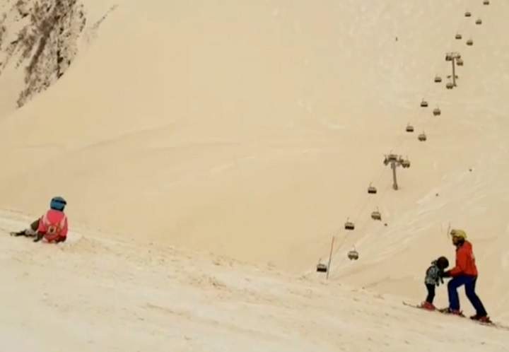 Orange snow blankets Russian Ski Resort Gorky Gorod in Estosadok, Russia March 23, 2018 in this picture grab obtained from social media video. Picture taken March 23 ,2018.