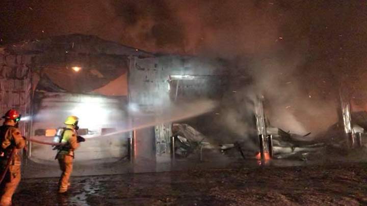 Firefighters battle a farm structure blaze near Osler, Sask.