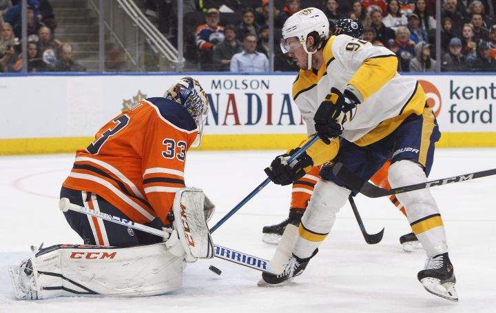 Nashville Predators' Ryan Johansen (92) is stopped by Edmonton Oilers goalie Cam Talbot (33) during first period NHL action in Edmonton, Alta., on Thursday March 1, 2018. 
