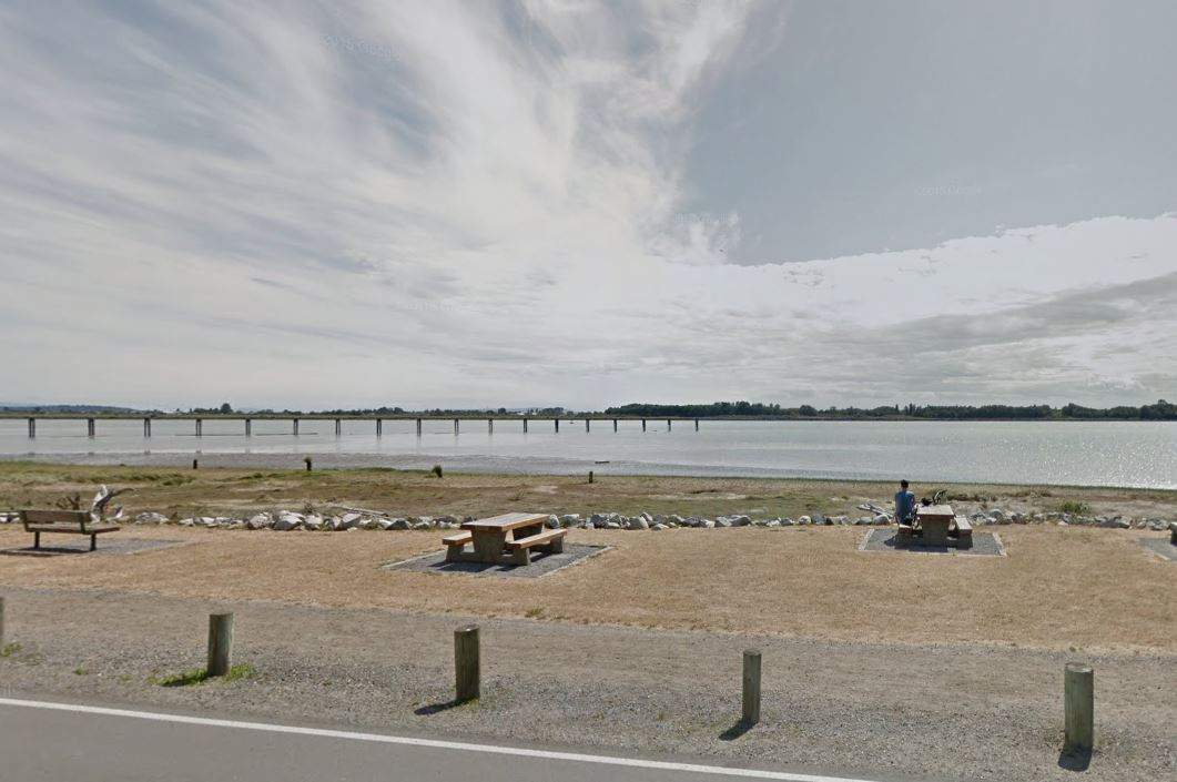 View of the beach off Dyke Road, where the victim was found in the water Saturday morning.