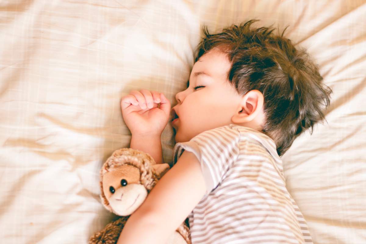 Try keeping your child's room dark by using blackout curtains, experts suggest.