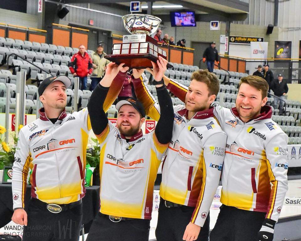 Team Laycock hoists the SaskTel Tankard trophy after punching their ticket to the 2018 Tim Hortons Brier. L-R Skip Steve Laycock, third (throws fourth stones) Matt Dunstone, second Kirk Muyres and lead Dallan Muyres.