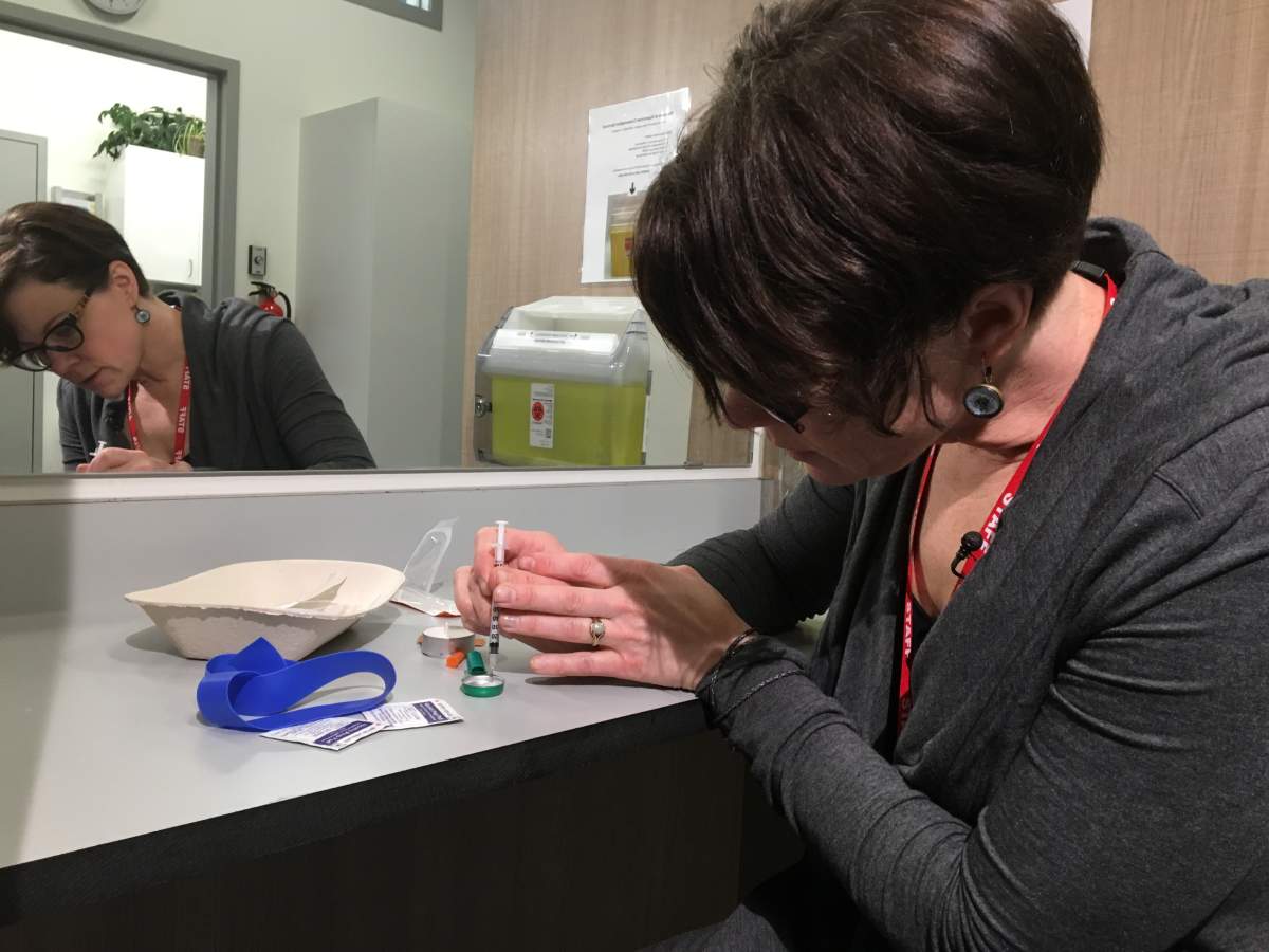 Lead registered nurse Katrina Stephenson shows how injection will work at at the supervised consumption site at Boyle Street Community Services (10116-105 Ave.) in downtown Edmonton. Stephenson worked at the safe injection site in Vancouver from 2010 to 2013, and will be supervising the location in Edmonton where people can carry out safer injection of drug under the watch of medical professioals. March 22, 2018. 