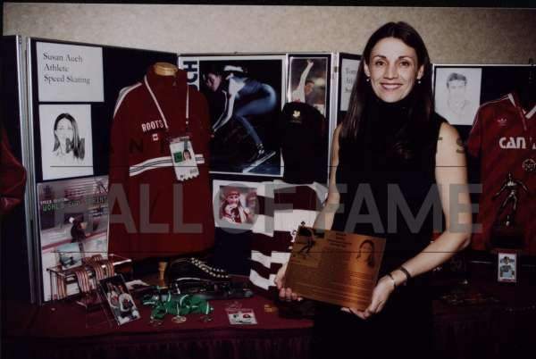 Susan Auch along with her display in the Manitoba sports Hall of fame