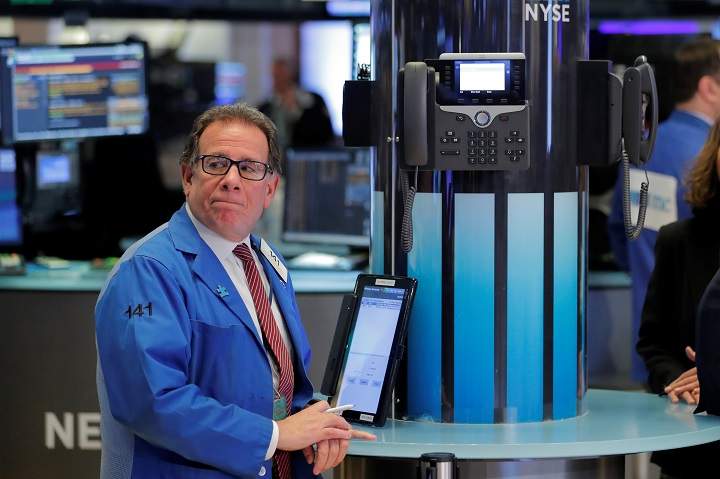 Traders work on the floor of the New York Stock Exchange shortly in New York, U.S., on March 19, 2018.