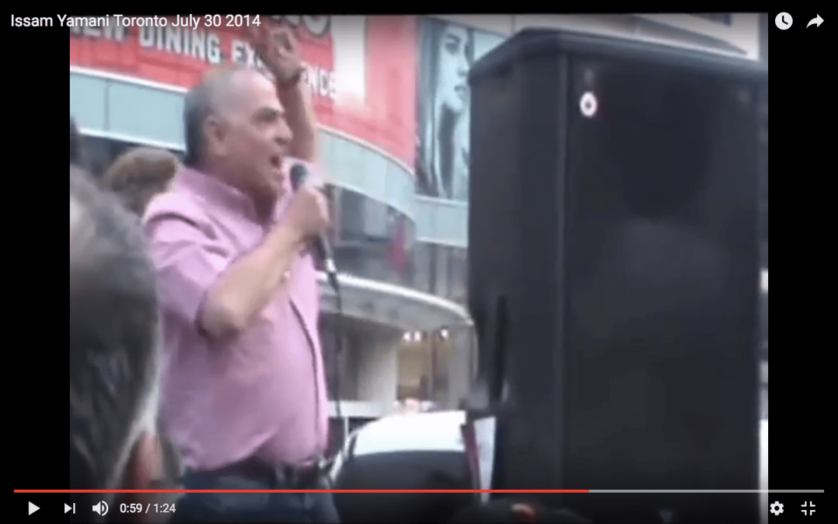 Issam Al-Yamani speaks during a protest at Toronto’s Dundas Square in 2014. The CBSA alleges he incited violence.