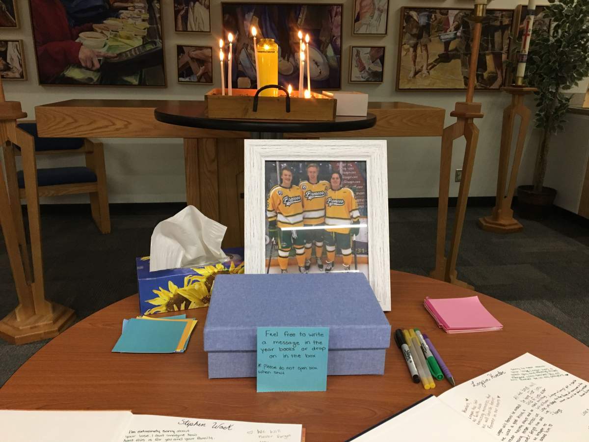 Students and staff at St. Albert Catholic High School mourn the loss of three Humboldt Broncos. April 12, 2018.