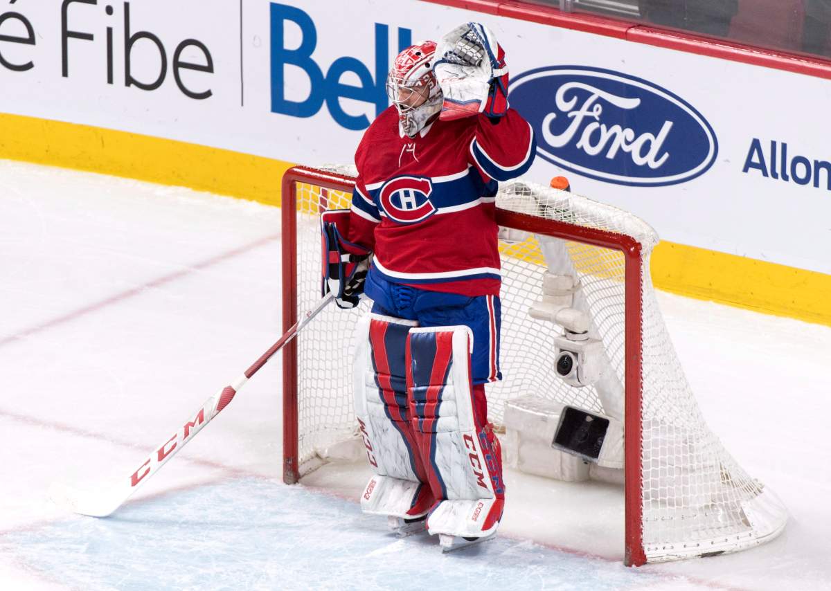 Montreal Canadiens goaltender Carey Price acknowledges applauds from the crowd for his 557th game with the Canadiens as they face the Winnipeg Jets during first period NHL hockey action Tuesday, April 3, 2018 in Montreal.
