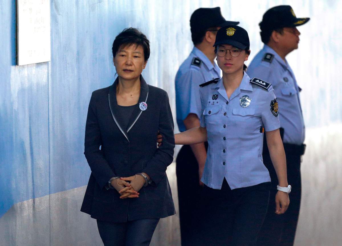 FILE - In this Aug. 7, 2017, file photo, former South Korean President Park Geun-hye, left, arrives for her trial at the Seoul Central District Court in Seoul.