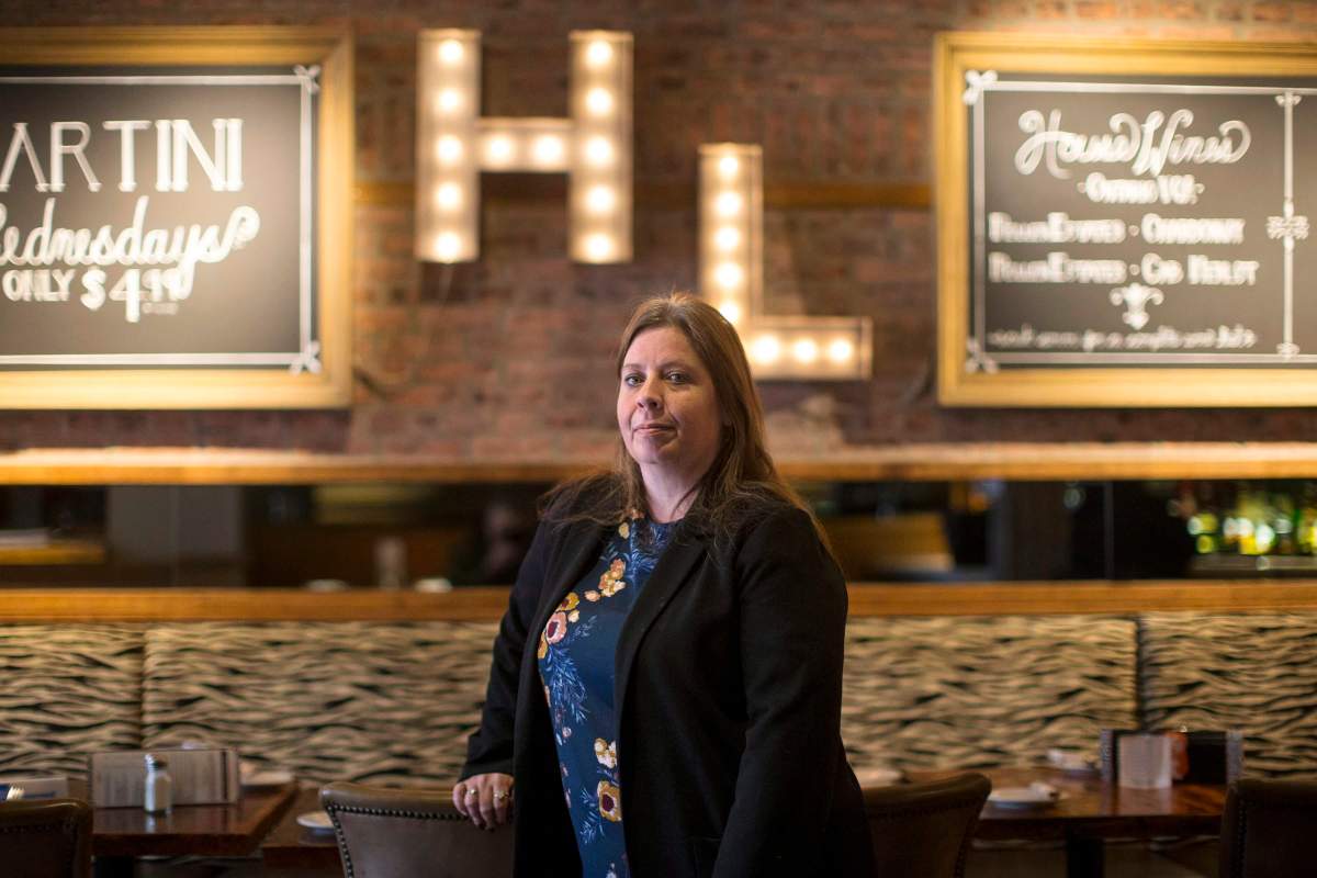 Ginger Hunt, general manager of "Hey Lucy," is pictured in the restaurant in Toronto on Saturday, April 7, 2018. Hunt is trying to offer customers a more inclusive dining experience by encouraging servers to use gender-neutral greetings so not only "ladies" and "gents" feel welcome, but "friends" across the gender spectrum.