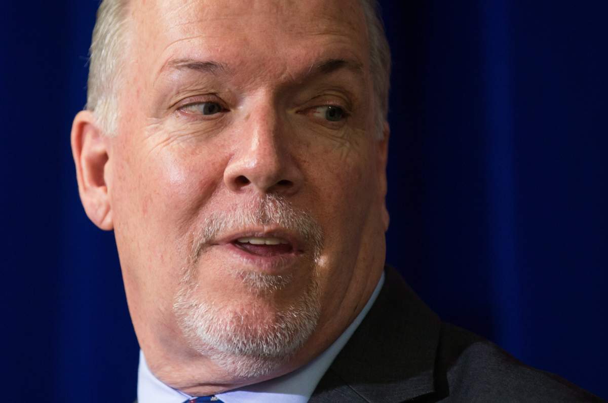 British Columbia Premier John Horgan listens during a housing announcement in Coquitlam, B.C., on Friday April 13, 2018.