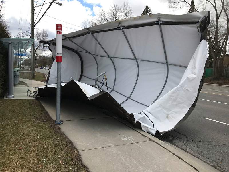 A garage canopy is next to a bus stop at Lawrence and Bond streets in Toronto on April 4, 2018.