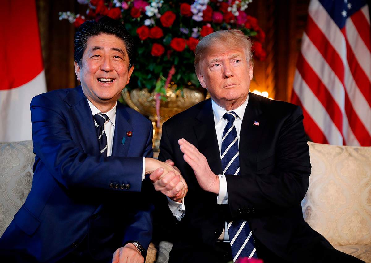 In this April 17, 2018 file photo, President Donald Trump and Japanese Prime Minister Shinzo Abe speak during a meeting at Trump's private Mar-a-Lago club, in Palm Beach, Fla.