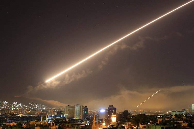 None
Damascus skies erupt with surface to air missile fire as the U.S. launches an attack on Syria targeting different parts of the Syrian capital Damascus, Syria, early Saturday, April 14, 2018. Syria’s capital has been rocked by loud explosions that lit up the sky with heavy smoke as U.S. President Donald Trump announced airstrikes in retaliation for the country’s alleged use of chemical weapons. 