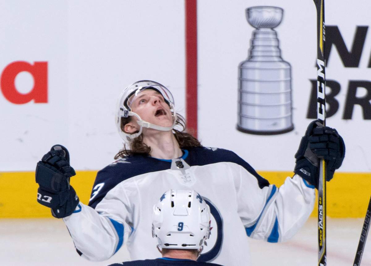 The Winnipeg Jets' Sami Niku celebrates his goal past Montreal Canadiens goaltender Carey Price during third-period NHL hockey action Tuesday, April 3, 2018 in Montreal.