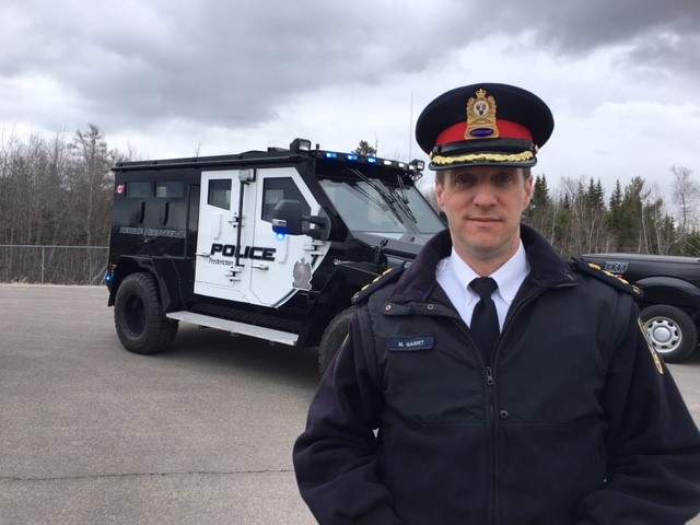 Deputy Police Chief Martin Gaudet poses with the Fredericton Police Force’s new armoured vehicle on April 19, 2018,