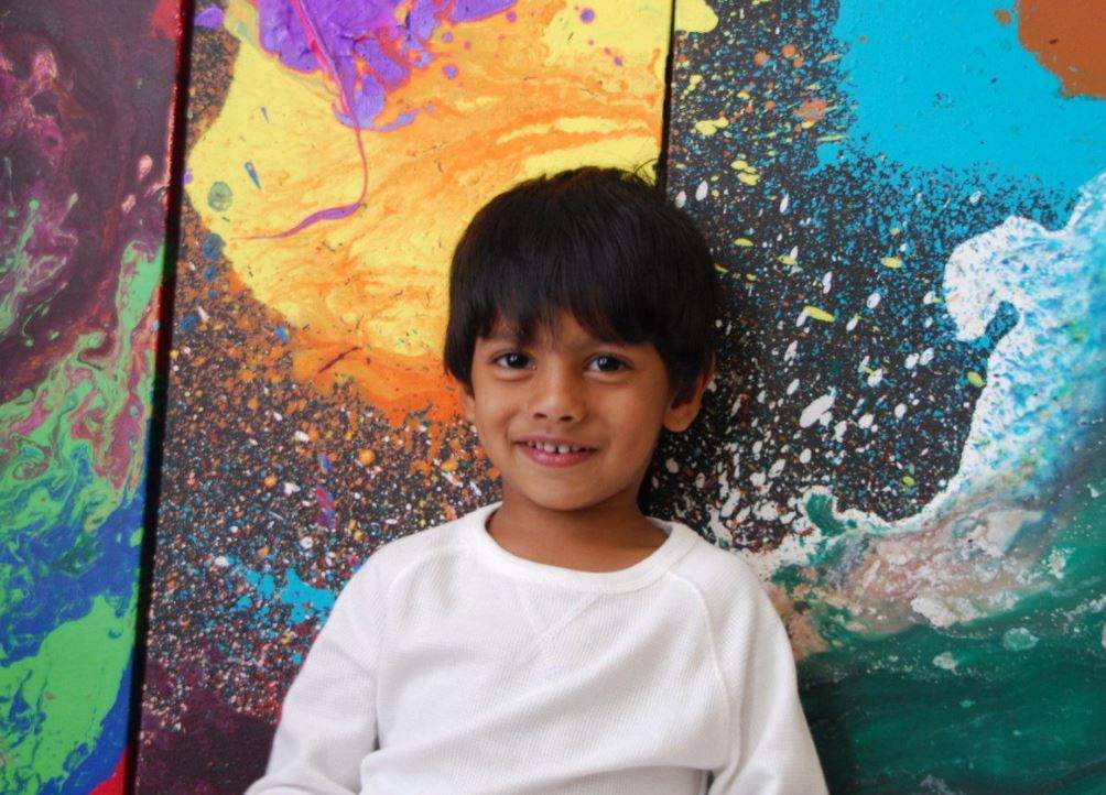 Advait Kolarkar, 4, is seen in this undated handout photo. When he’s not playing with dinosaurs or reading a book, 4-year-old Advait Kolarkar uses paint, canvases and his imagination to create internationally-recognized abstract artwork. The preschooler is already selling his paintings for thousands of dollars and has had his art featured in three exhibits.