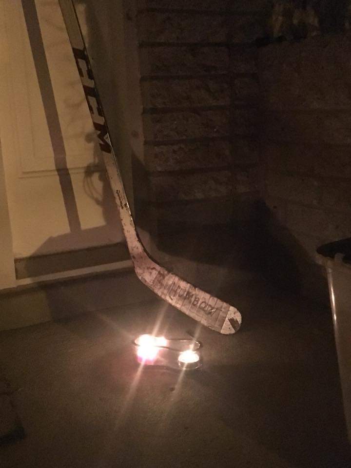 Christopher Scott put out his hockey stick to honour the Broncos hockey team.