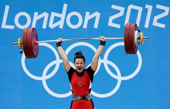 Canada’s Christine Girard competes during the women’s 63-kg weightlifting competition at the 2012 Summer Olympics in London.