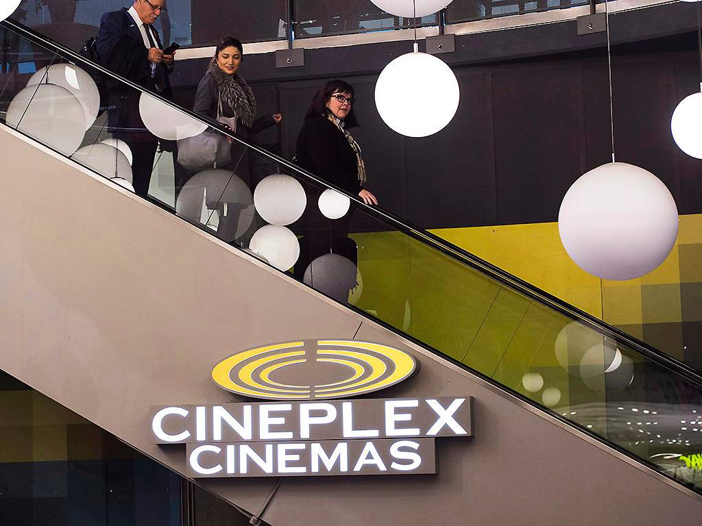 People leave a Cineplex theatre in Toronto on November 4, 2016. 
