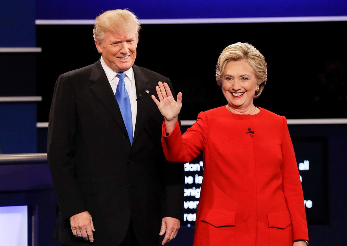  In this Sept. 26, 2016, file photo, then-Republican presidential nominee Donald Trump and then-Democratic presidential nominee Hillary Clinton are introduced during the presidential debate at Hofstra University in Hempstead, N.Y.