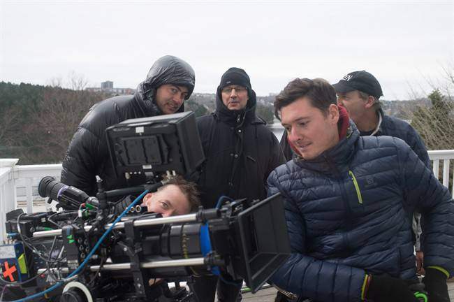 FILE - Halifax-based camera operator Andrew Stretch, right in blue jacket, and other crew on the set of Haven, a supernatural drama filmed in Nova Scotia.