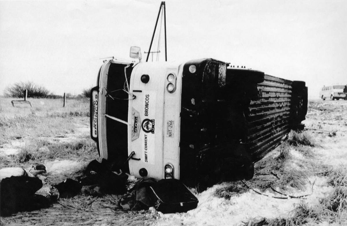 Luggage and equipment bags lie strewn around the Swift Current Broncos’ bus following an accident Dec. 30, 1986 in which four players were killed. The mishap occurred at about 3:45 p.m. CST on the Trans-Canada highway about six kilometres east of Swift Current.