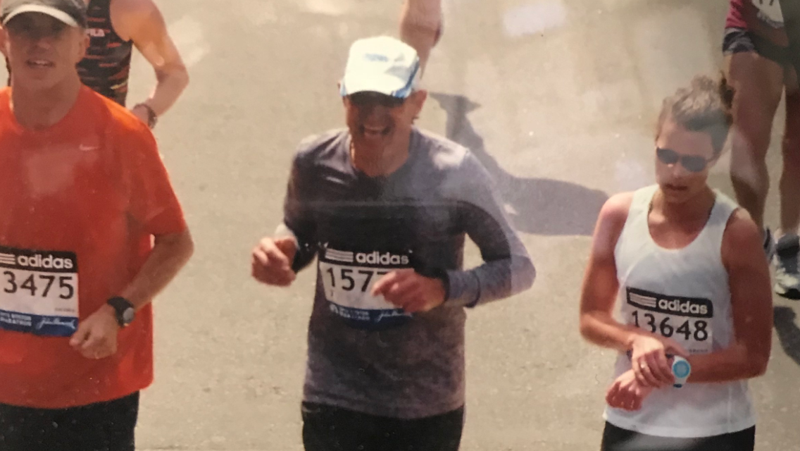 D.J. De Jesus, middle, completed the 2013 Boston Marathon just ten minutes before the first bomb went off.