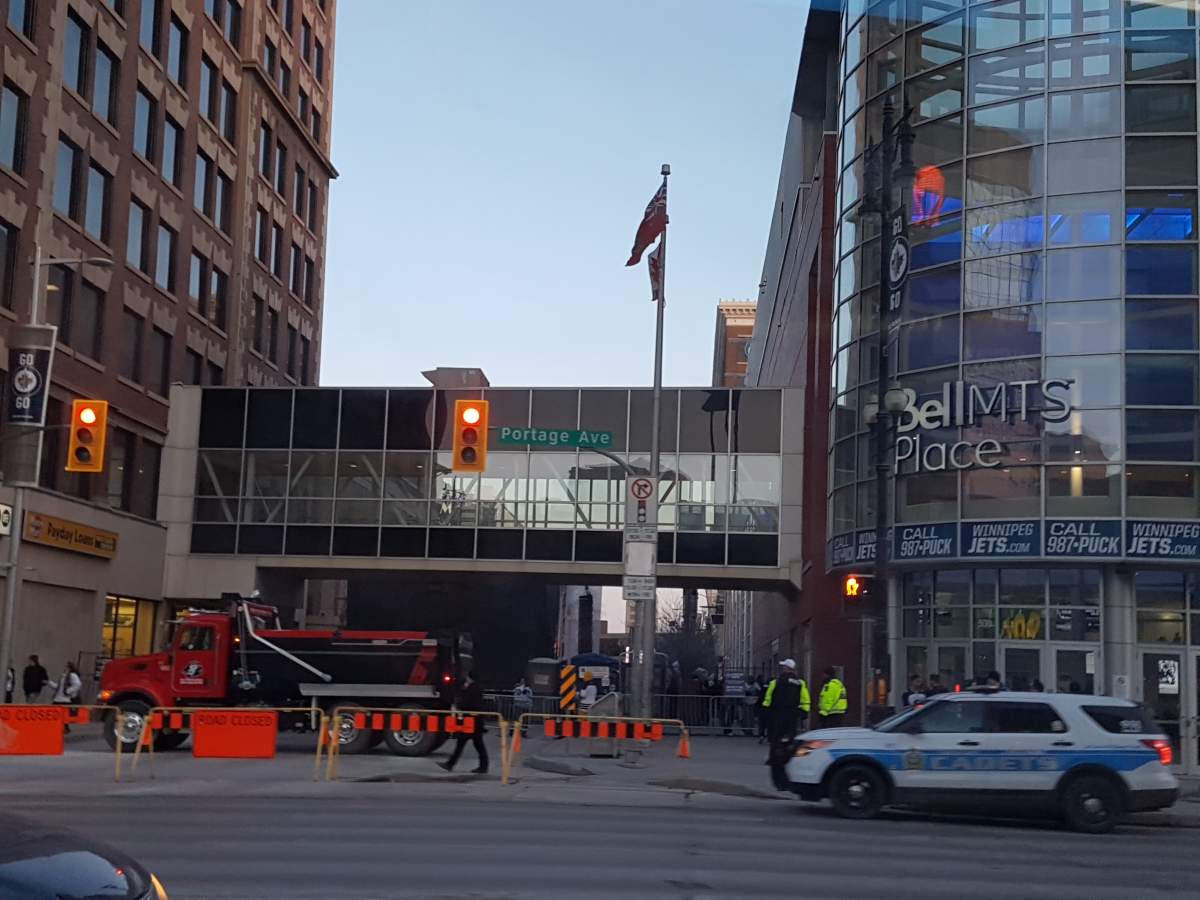 A dump truck is parked on Donald Street at Portage Avenue, the northern access point to the Whiteout Street Party.