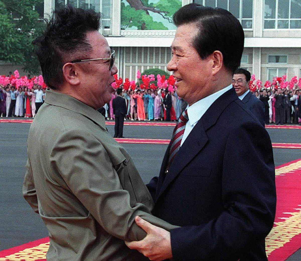 South Korean President Kim Dae Jung, right, hugs North Korean leader Kim Jong Il at the end of their summit meeting, June 15, 2000.