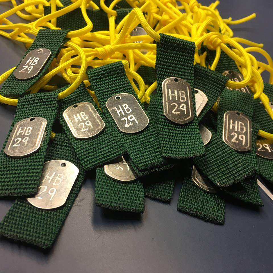 Green and yellow zip tags are being sold for $5.00 each in support of the Humboldt Broncos. 