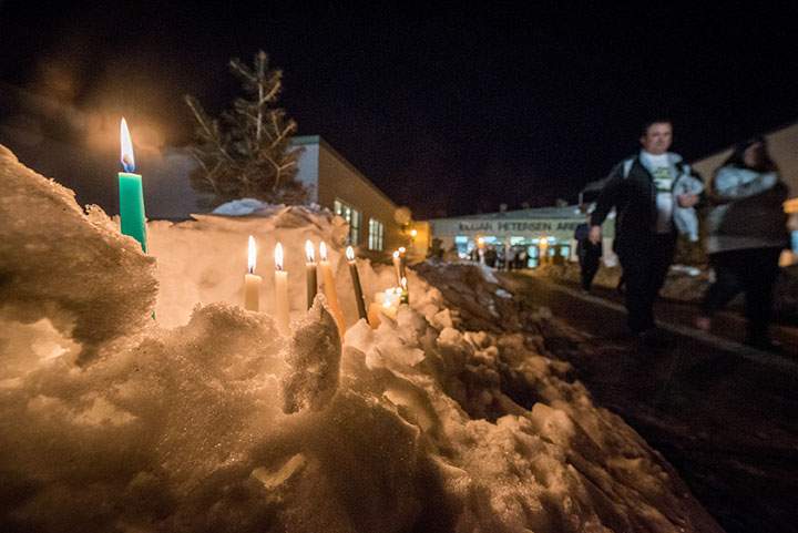 Candles burn to show support for the victims and families of a fatal bus crash is on display as members of the community leave a vigil for the Humboldt Broncos in Humboldt, Saskatchewan, Canada April 8, 2018.