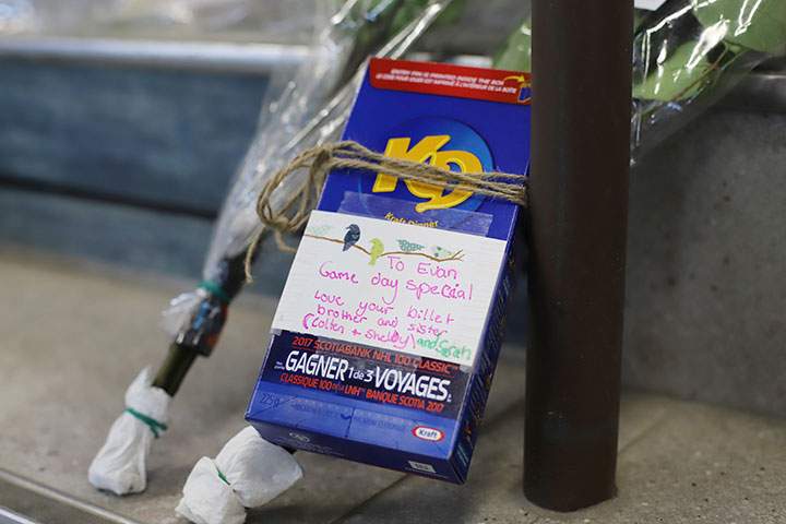 A box of Kraft Dinner is left at a makeshift memorial at the Humboldt Uniplex in Humboldt, April 8, 2018.