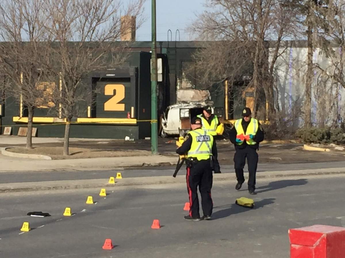 Investigators work to figure out how a van crossed over the median and crashed into the Nygard building Friday morning.