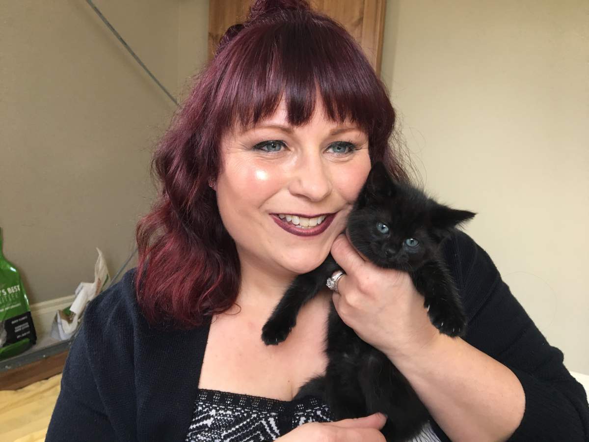 Pawsitive Match volunteer Kerri Ridge with kitten Jelly.