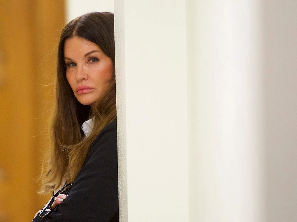 Bill Cosby accuser Janice Dickinson waits outside a courtroom in the Montgomery County Courthouse before testifying on the fourth day of the sexual assault retrial on April 12, 2018 in Norristown, Pennsylvania. 