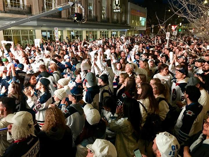 Jets fans celebrate at a Whiteout Street Party in downtown Winnipeg in this 2018 file photo.